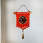 Terracotta Jagannath Face on Jute Base Wall Hanging Orange- Handmade & Handpainted Decorative Wall Hanging (Garden, Livingroom, Showpiece, Gift, Decor, Home Decor)